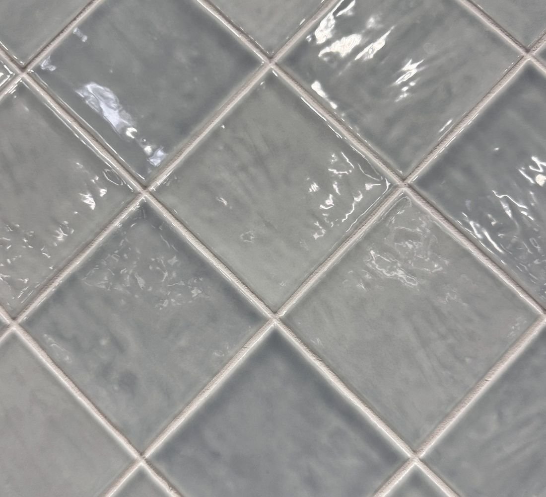 Close view of glazed tile surfaces and the joints between them