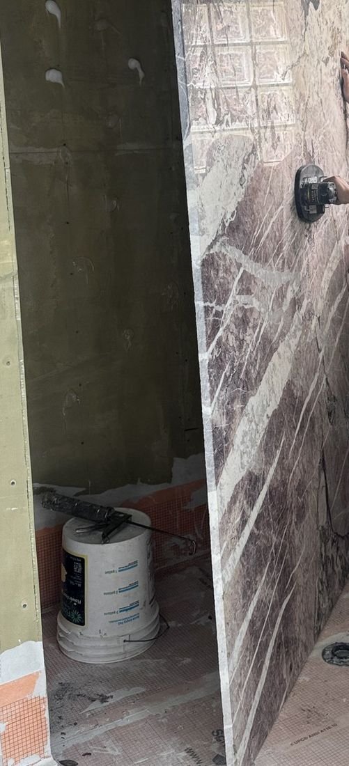 Large stone panel and an adjacent opening during installation
